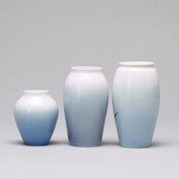 BING & GRÖNDAHL and ROYAL COPENHAGEN, a set of three porcelain vases and a dish, Denmark.