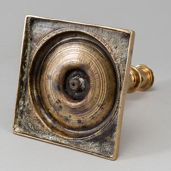 A 17th century bronze candlestick.