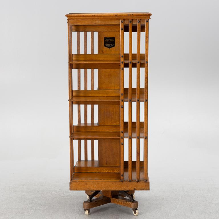 An oak Revolving bookcase by Trübner & Co, England, early 20th century.