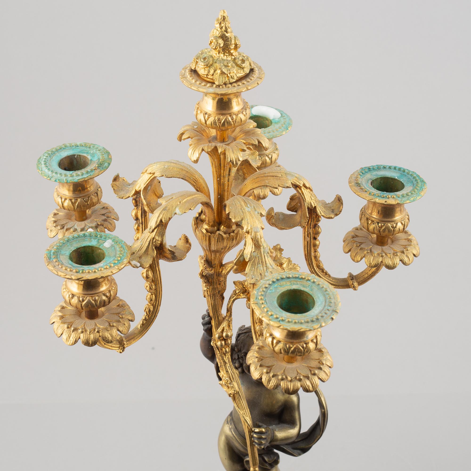 A pair of bronze and marble candelabra, possibly France, late 19th century.