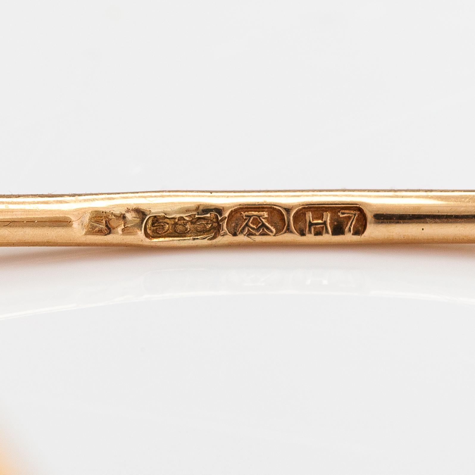 Elis Kauppi, A 14K gold bracelet/bangle with tiger's eyes. Kupittaan kulta, Turku 1961.