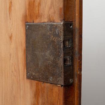 A late Baroque walnut-veneered cabinet in the manner of J. H. Fürloh, mid 18th century.