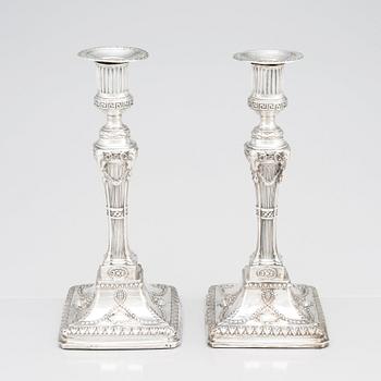 An English pair of 18th Century silver candlesticks, mark of John Winter & Co, Sheffield 1775.