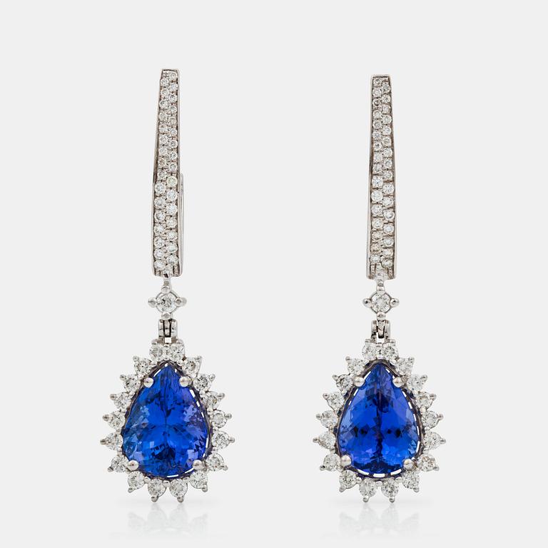 A pair of tanzanite and brilliant-cut diamond earrings. Tanzanites total carat weight 9.10 cts, diamond weight 2.10 cts.