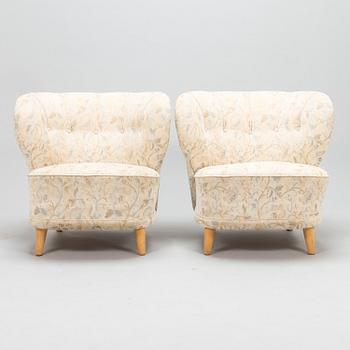 A pair of mid 20th century armchairs.
