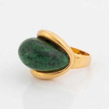 A Georg Jensen & Wendel ring in 18K gold set with a green and black stone.