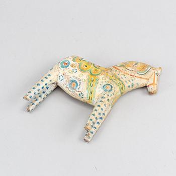 A painted Swedish wooden horse from the first half of the 20th century.