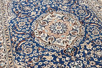 A Nain carpet, part silk, 9 laa, c. 300 x 189 cm.