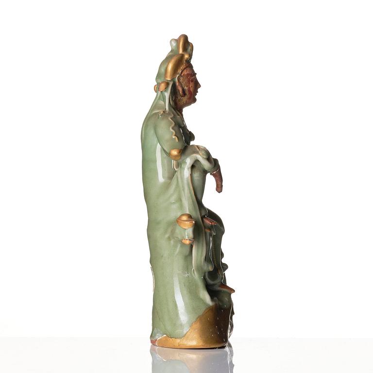 A celadon glazed figure of Guanyin, Ming dynasty (1368-1644).