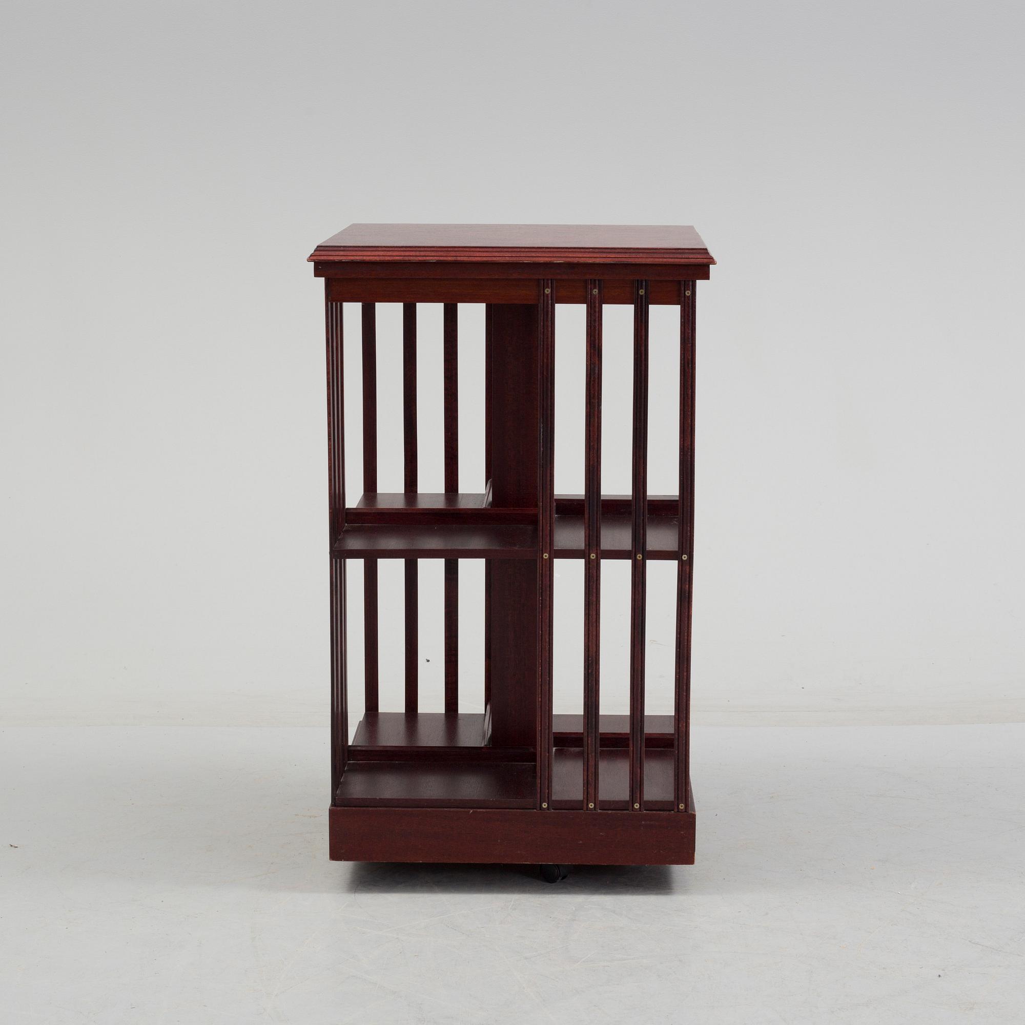 An second half of the 20th century turning book shelf veneered with mahogny.