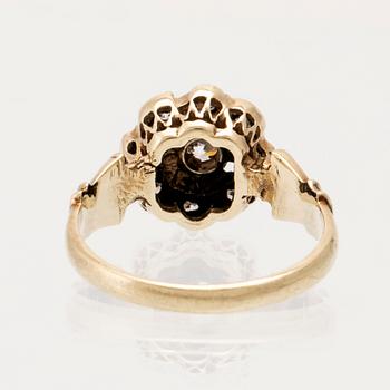 A 14K gold ring set with faceted stones.