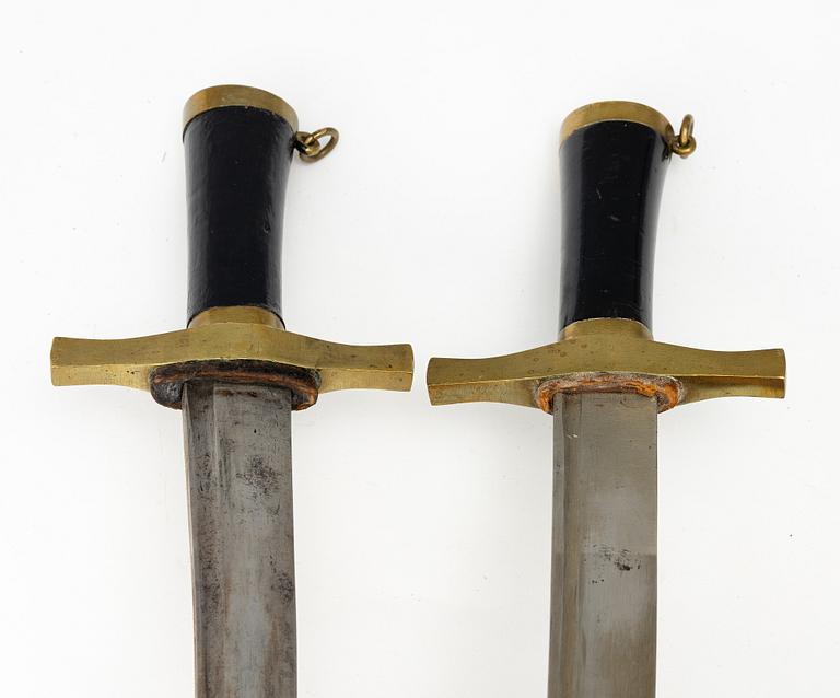 Two Swedish cutlasses 1856 pattern, with scabbards.