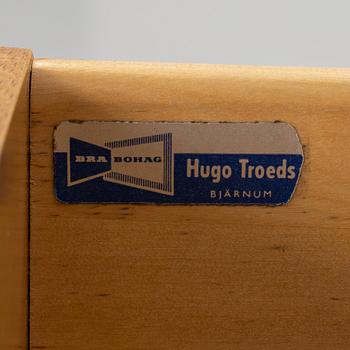 A desk with a drawer unit, Bra Bohag, Hugo Troeds, Bjärnu, mid 20th Century.