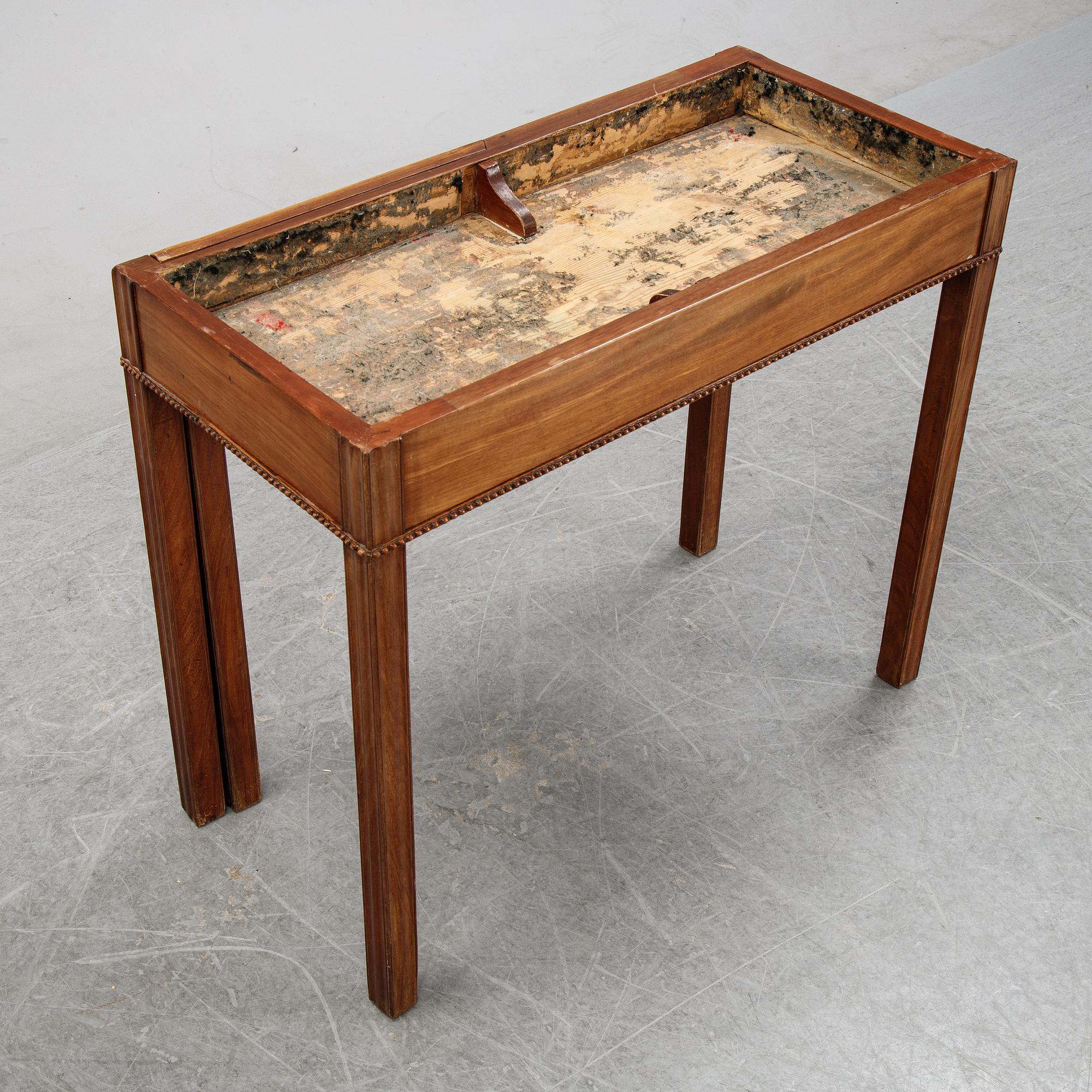A mahogany games table, circa 1800.