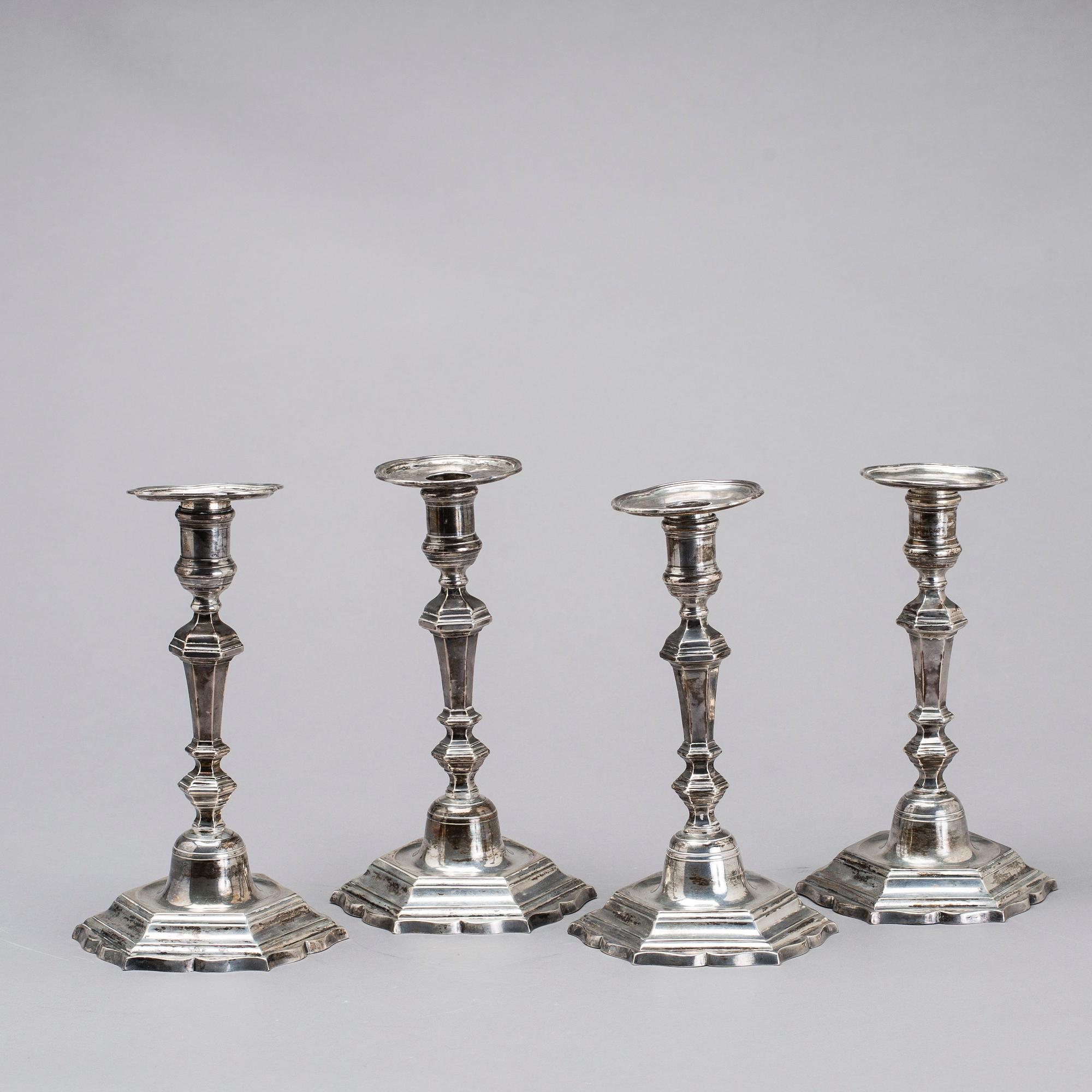 Two simular pairs of candlesticks, two marked Barde, Geneve 18th century, two with later marks.