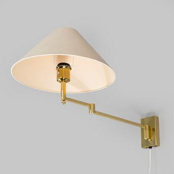 A 1970s/80s brass floor lamp, wall lamp and table lamp.