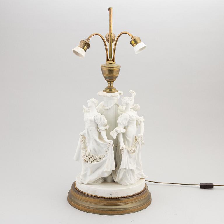 A parian and metall table lamp, first half of the 20th century.