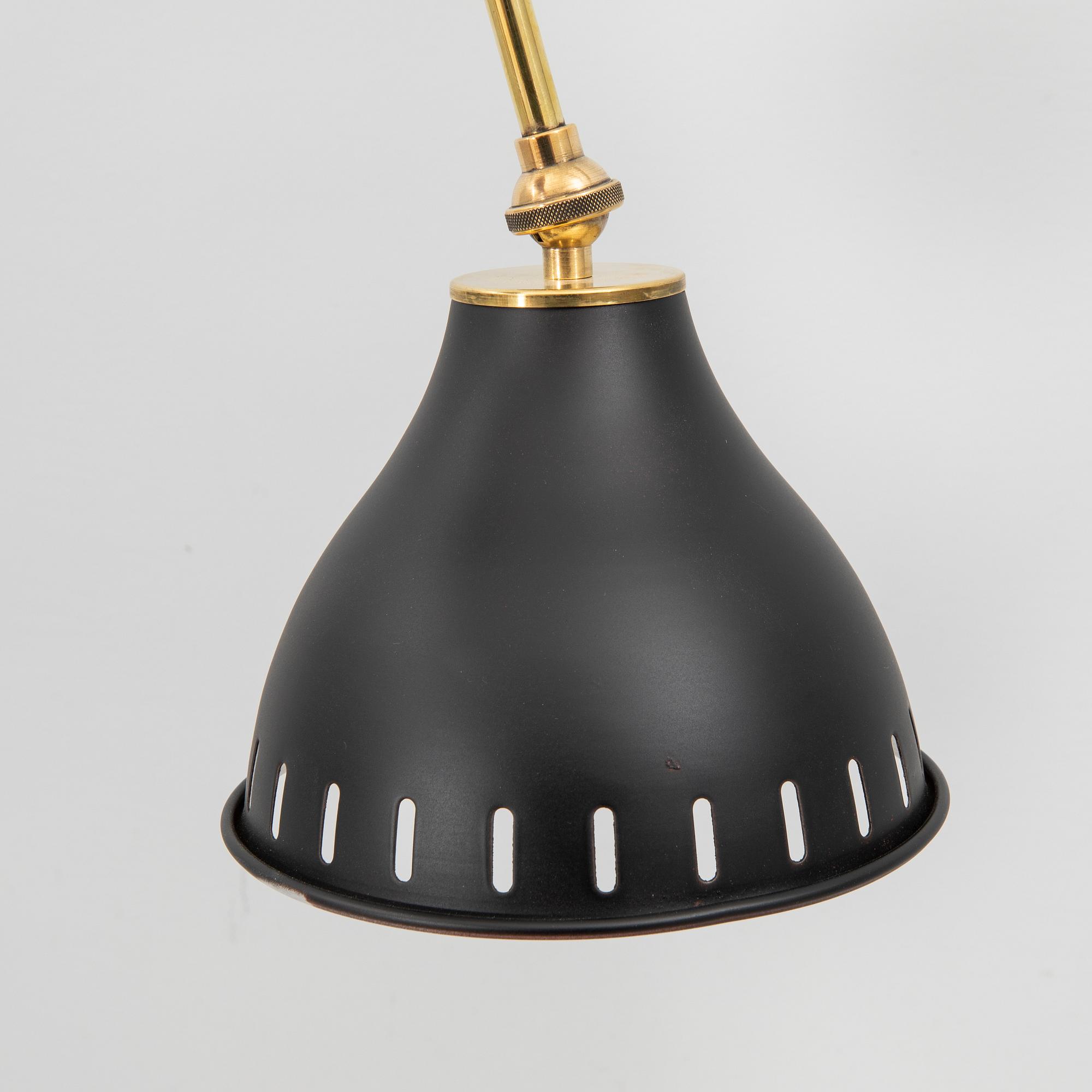 A bras wall lamp later part of the 20th century.