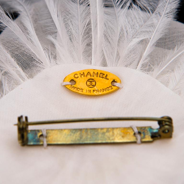 CHANEL, A White Chiffon Colifich Brooch.