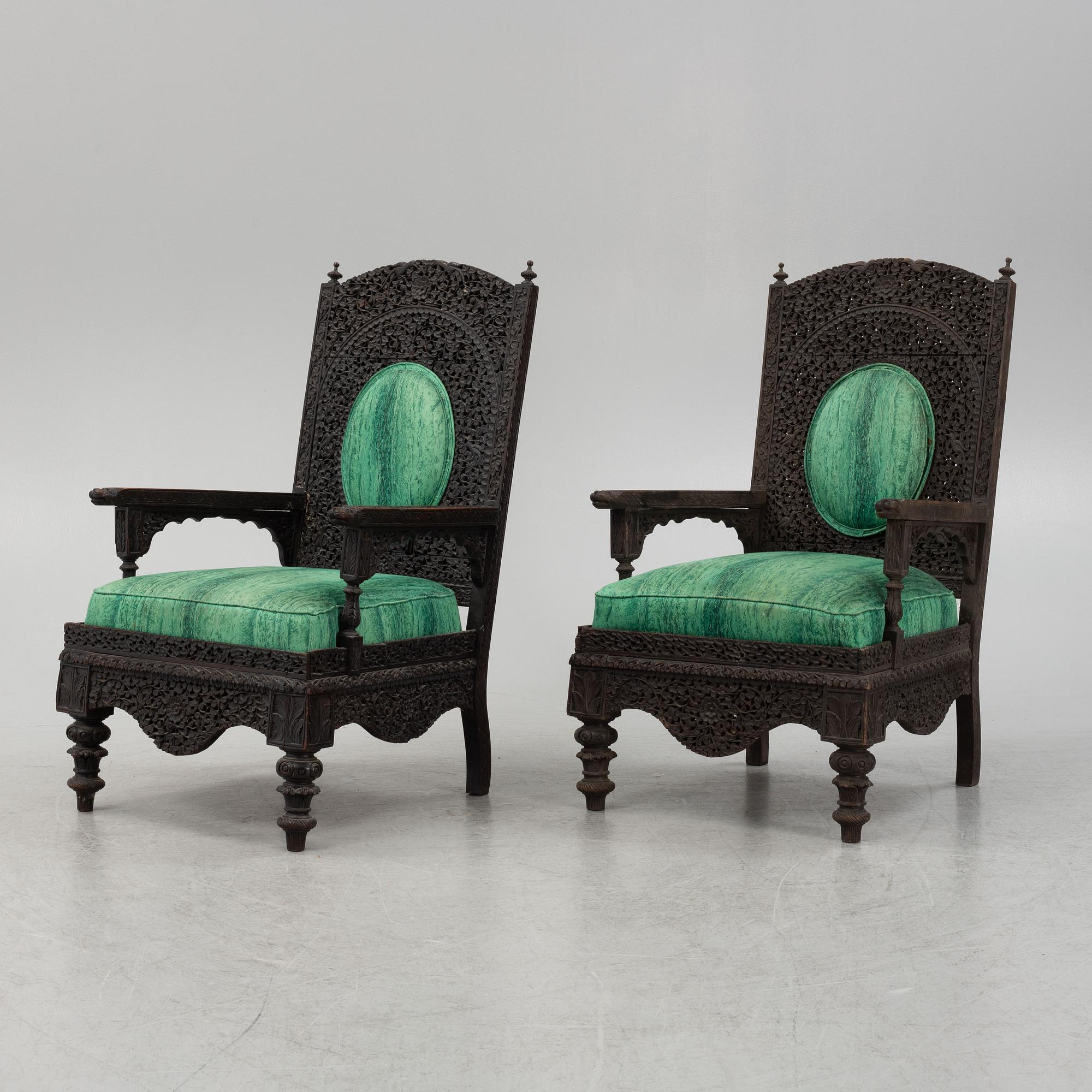 A pair of Angloindian carved chairs, India, 19th century, in so called 'Bombay style'.