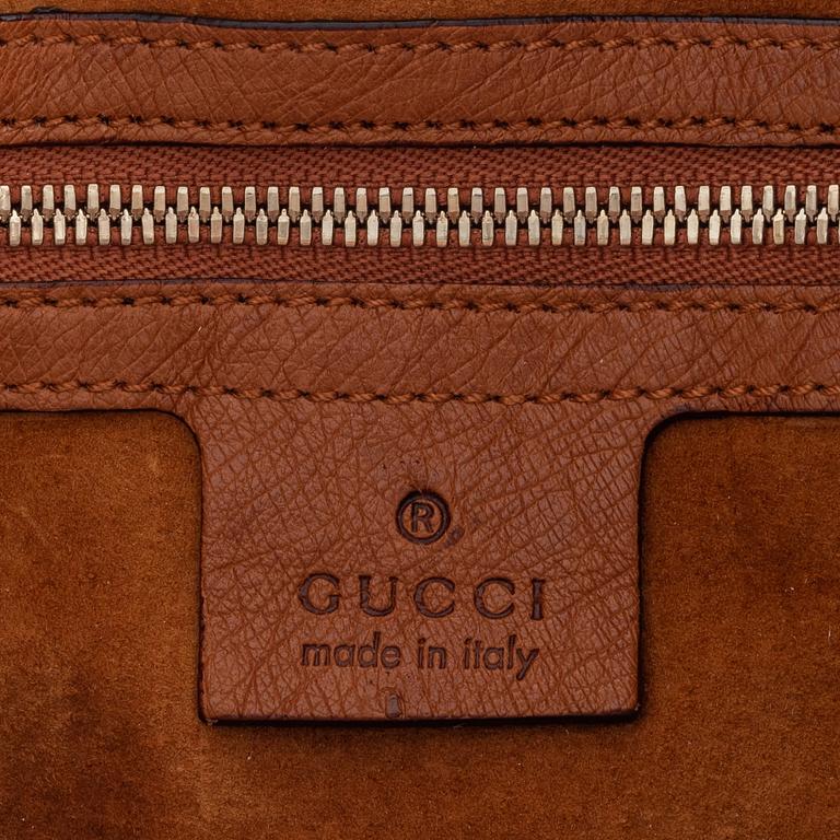 Gucci, an ostrich handbag.