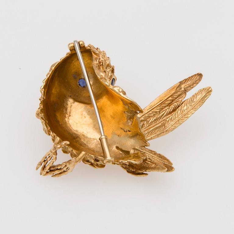 BROSCH, 18K guld, fasettslipade safirer.