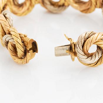 An 18K gold bracelet.