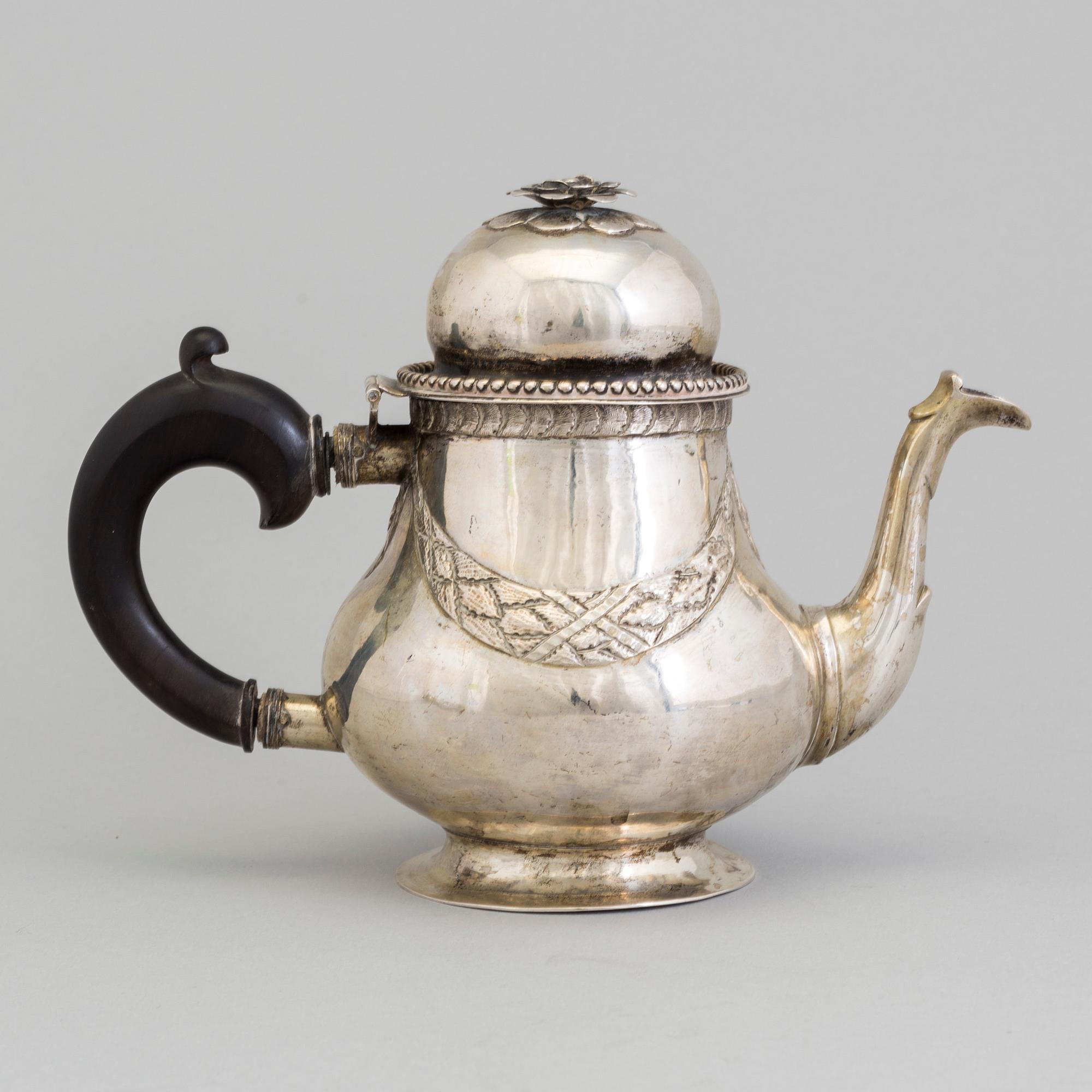 A late 18th century silver teapot.