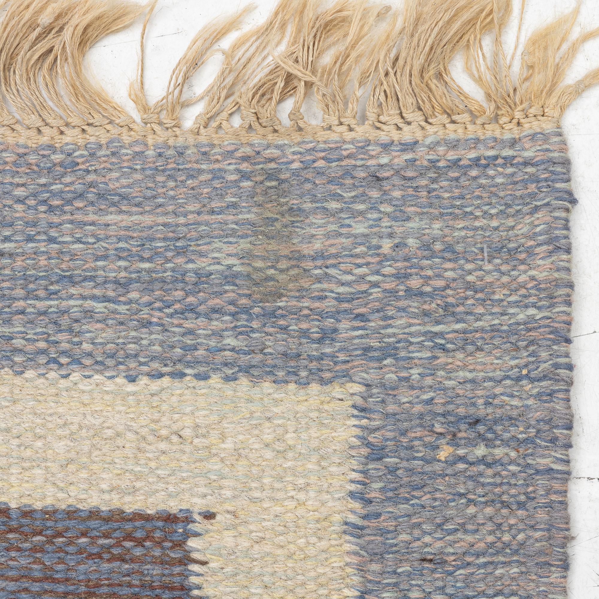 A flat weave rug, signed JK, approx. 195 x 137 cm.