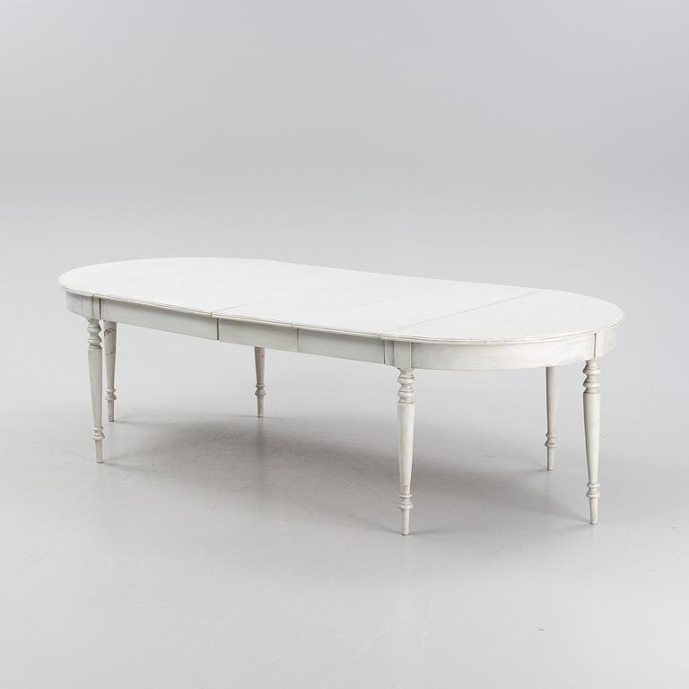 A painted dining table, 20th Century with older parts.