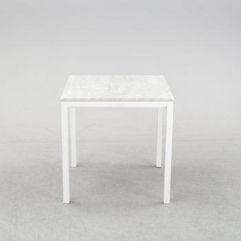 A marble top table, 21th century.
