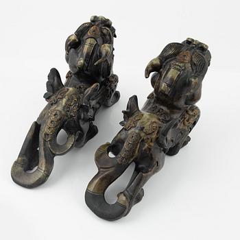 A pair of Chinese stone sculptures of mythical creatures, 20th Century.