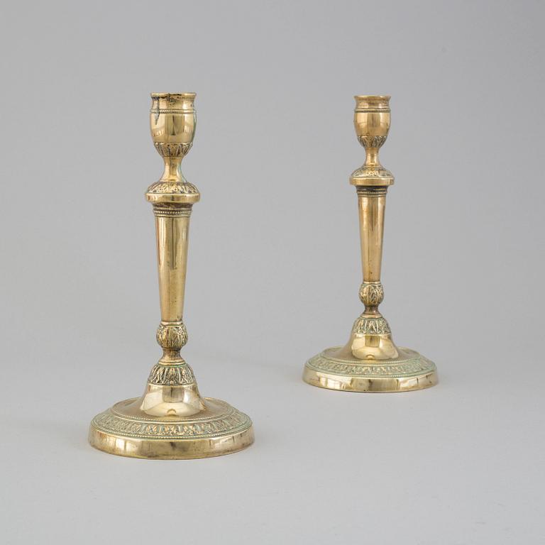 A pair of late 18th century bronze candlesticks.