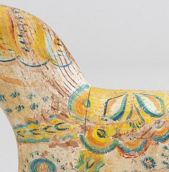 A painted Swedish wooden horse from the first half of the 20th century.