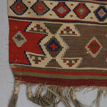 A carpet, a kilim, an antique Anatolian, ca 310-326 x 183,5-192 cm.