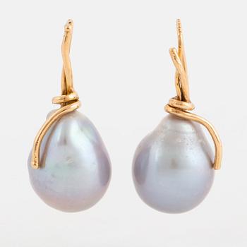 A pair of earrings with cultured baroque South Sea pearl.