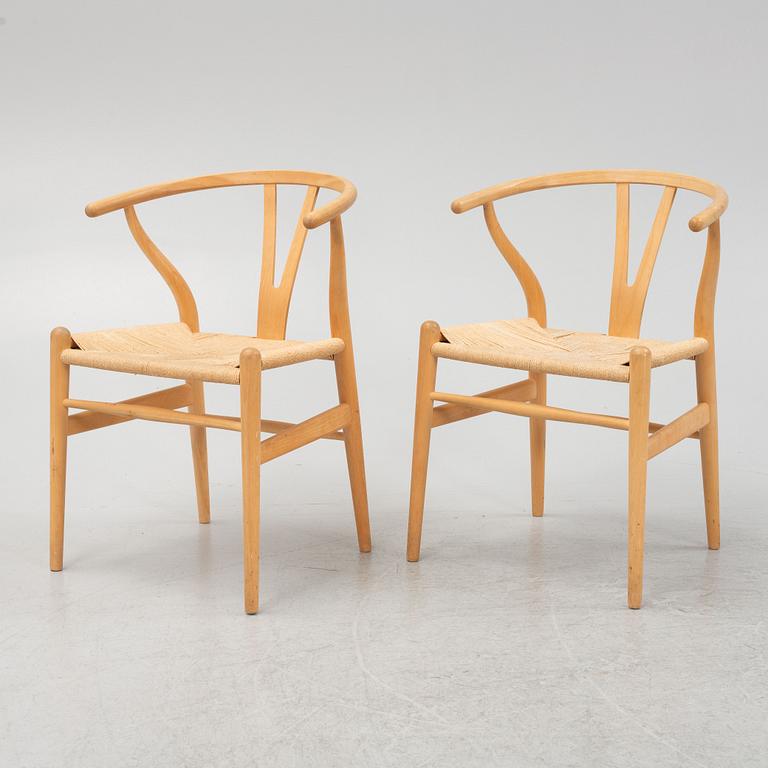 Hans J Wegner, a set of 6 model CH-24, "Wishbone" chairs, Carl Hansen & Son, Odense, Denmark, one dated 2007.