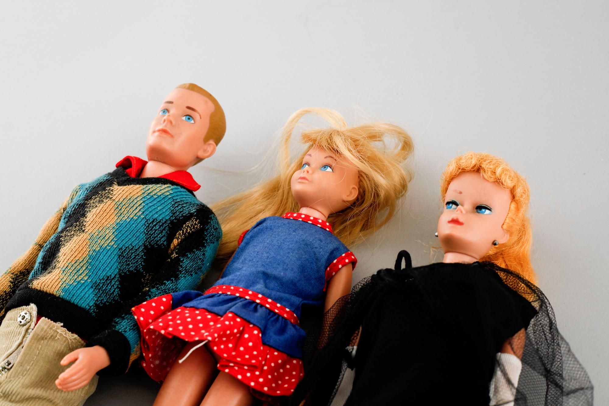 Three 1960s Barbie dolls with accessories, Mattel.