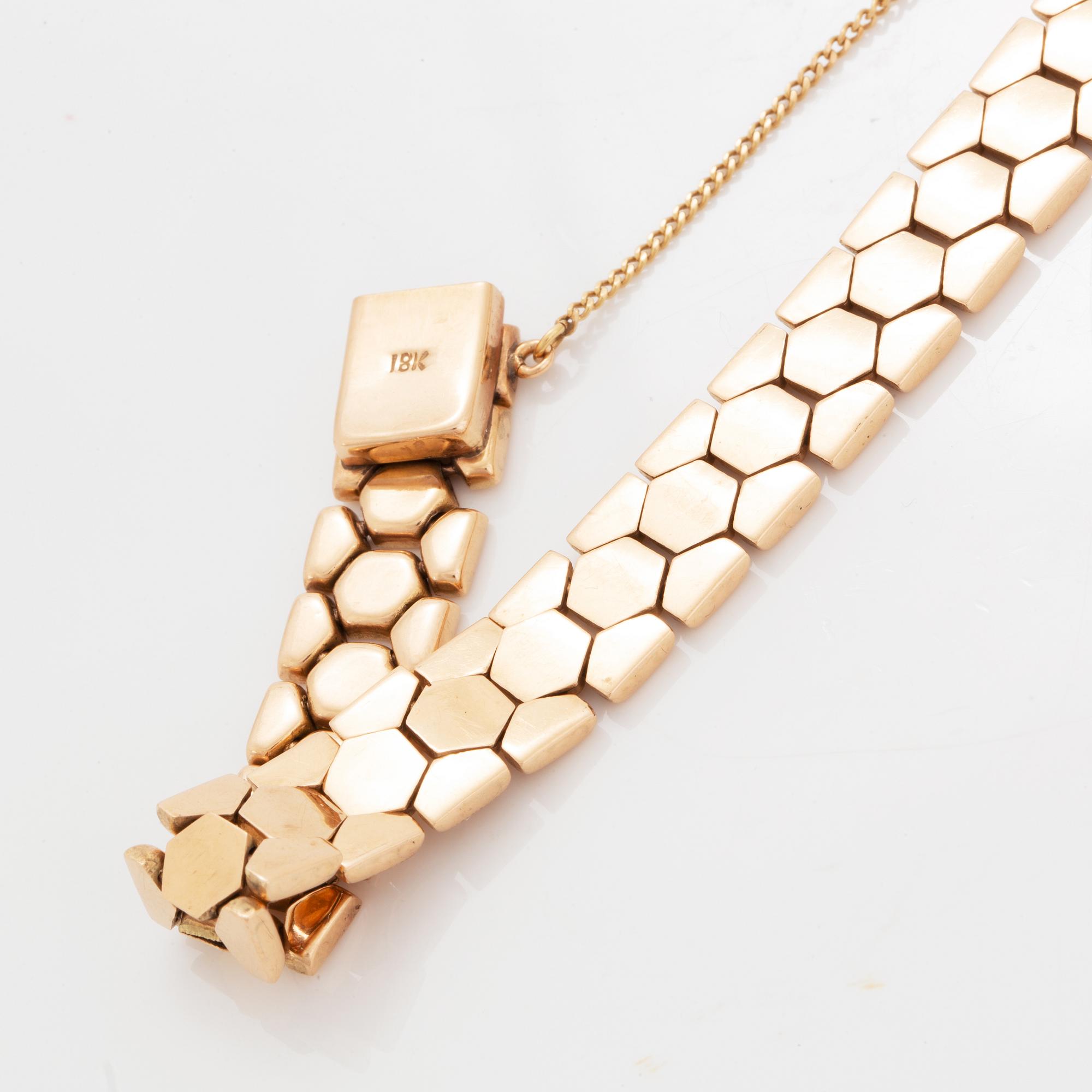 An 18K gold bracelet.