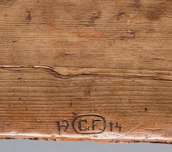 Gustaf Fjaestad, an Art Nouveau carved pine table, Arvika Sweden 1914, a double to the table in the Thiel Collection,