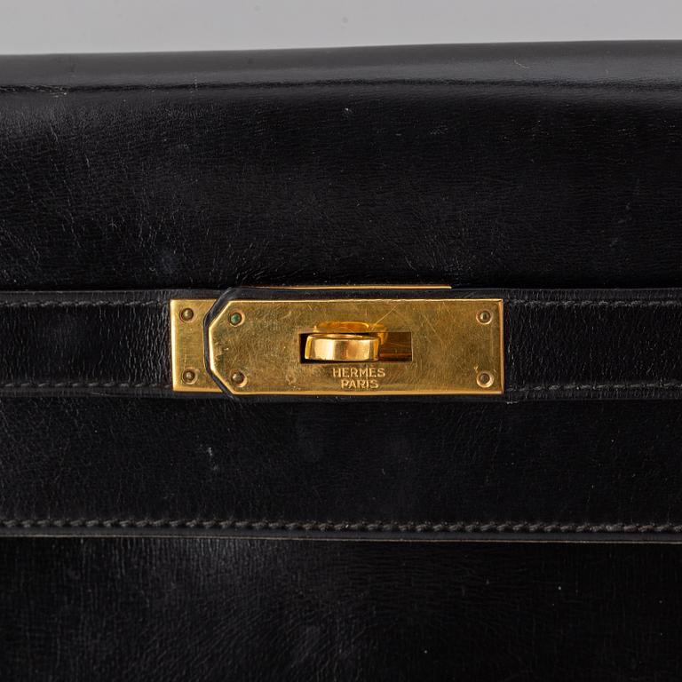 Hermès,a black leather 'Kelly 32' handbag, 1975.