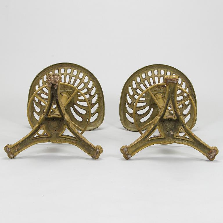 Four bar stools, painted cast iron, partly from the early 20th century.