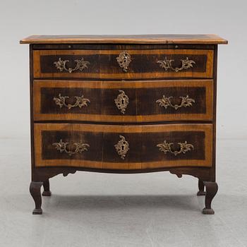 A 19th century Baroque style oak chest of drawers.