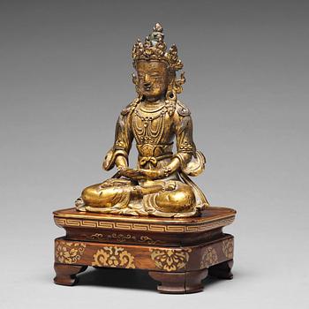 674. A gilt bronze figure of Amitayus buddha, Tibeto-Chinese, 18th Century.