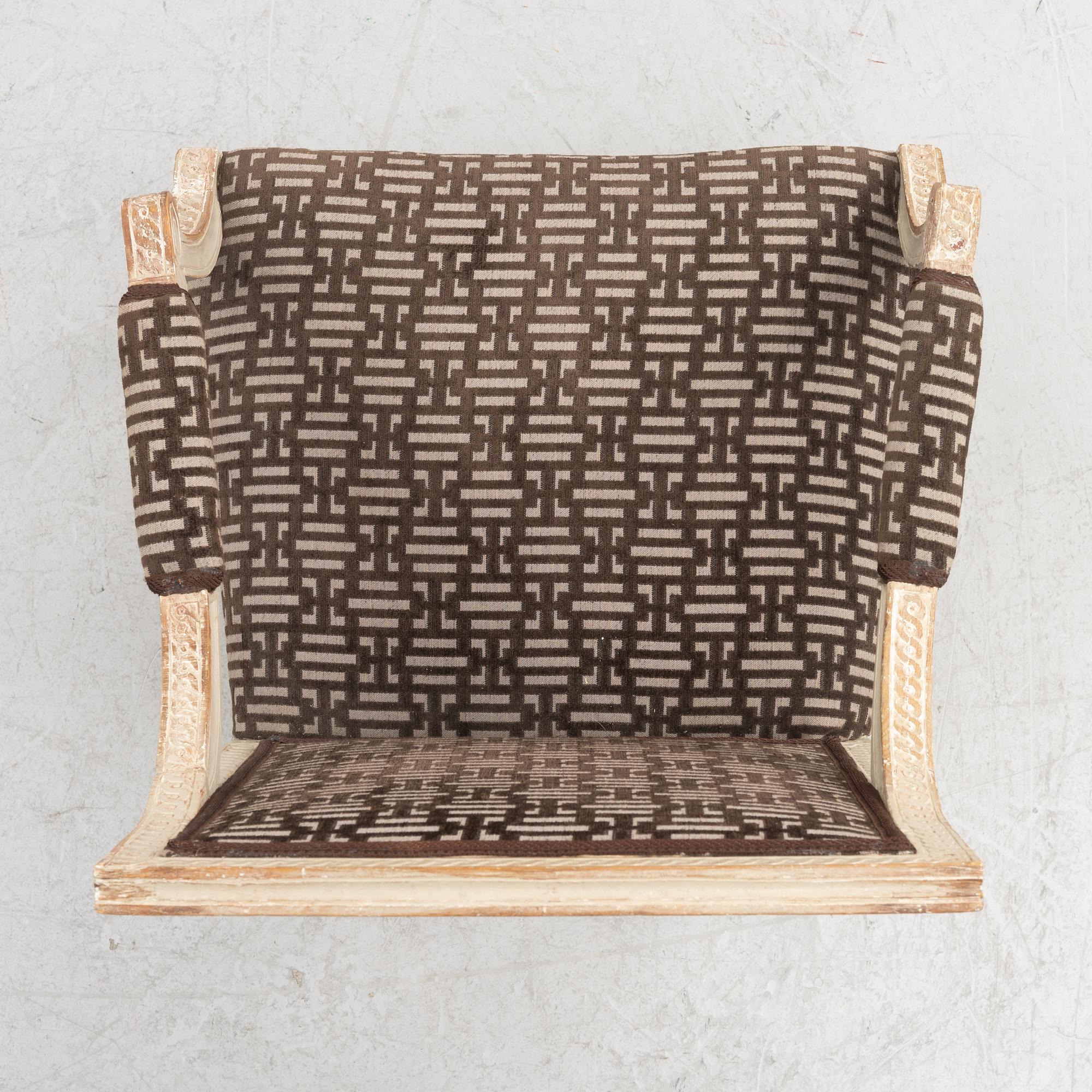 A Gustavian open armchair, Stockholm, late 18th century.