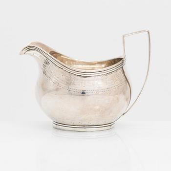 A Georgian sterling silver jug, late 18th century. Worn marks.