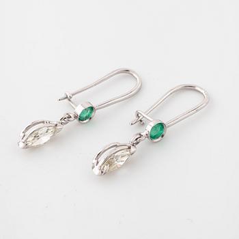 A pair of emerald and marquise cut diamond earrings.