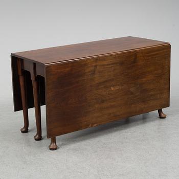 A two-piece mahogany gate leg table, 19th Century.