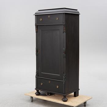 A cabinet, circa 1900.