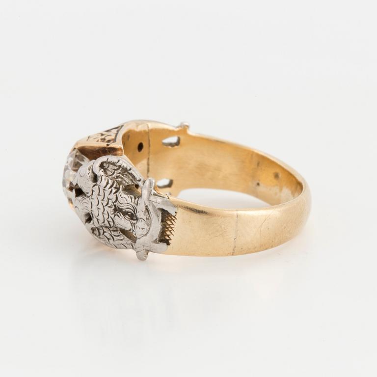 A ring set with an old-cut diamond.